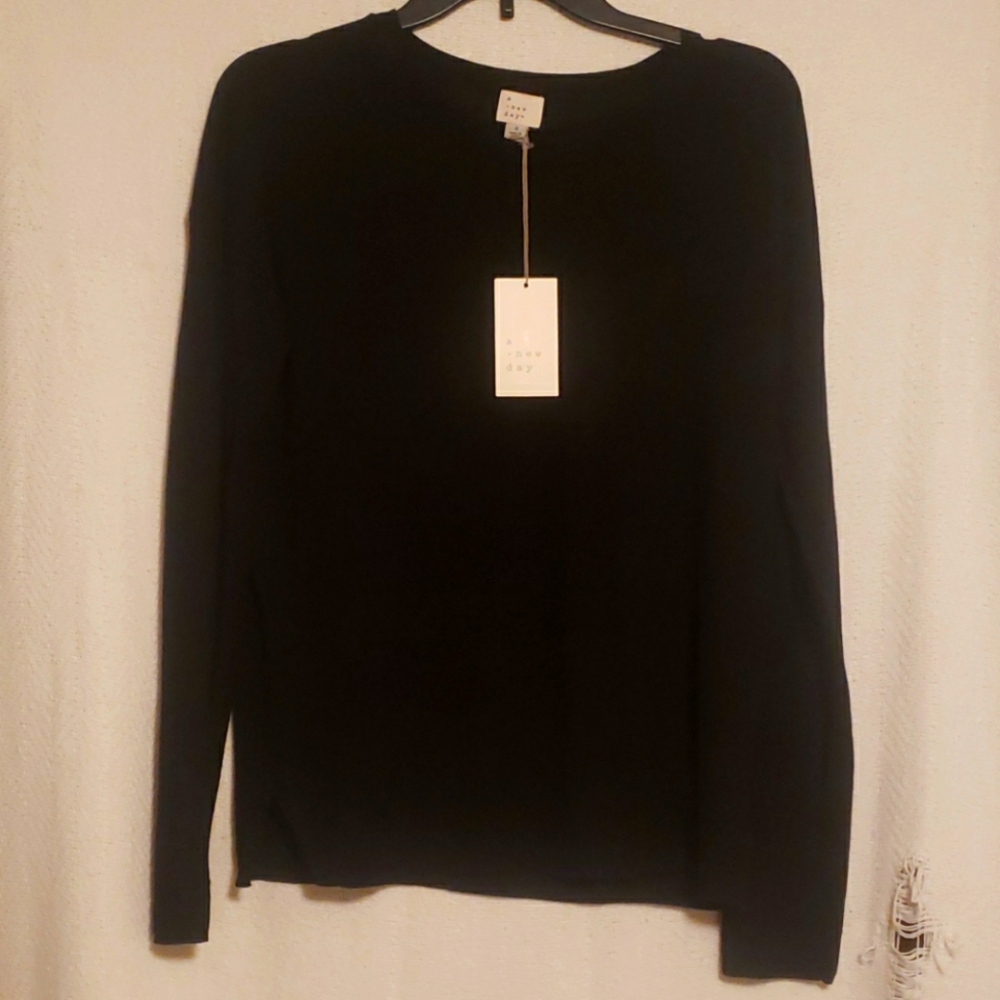 A New Day black sweater